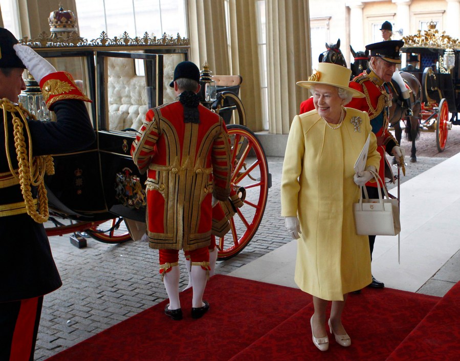 Britain's Queen Elizabeth and Prince Philip, Duke of Edinburgh, arrive at Buckingham Palace after the wedding ceremony of Britain's Prince William and Kate, Duchess of Cambridge, in London on April 29, 2011. (Photo by Andrew Winning/AFP/Getty)