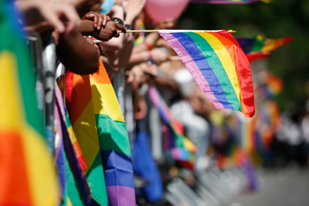 Sidewalks are filled with the rainbow flags as revelers celebrate Gay Pride in New York.