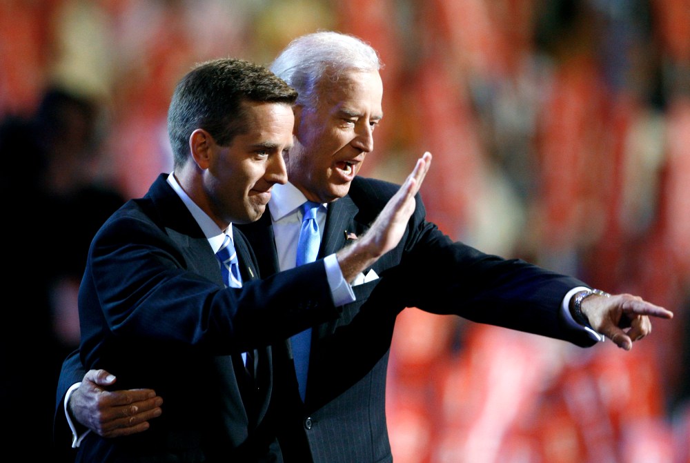 Then-Attorney General Beau Biden (D-DE) (L) and Vice Presidential candidate Senator Joe Biden (D-DE) gesture on stage at the 2008 Democratic National Convention in Denver, Colo., Aug. 27, 2008. (Photo by Chris Wattie/Reuters)