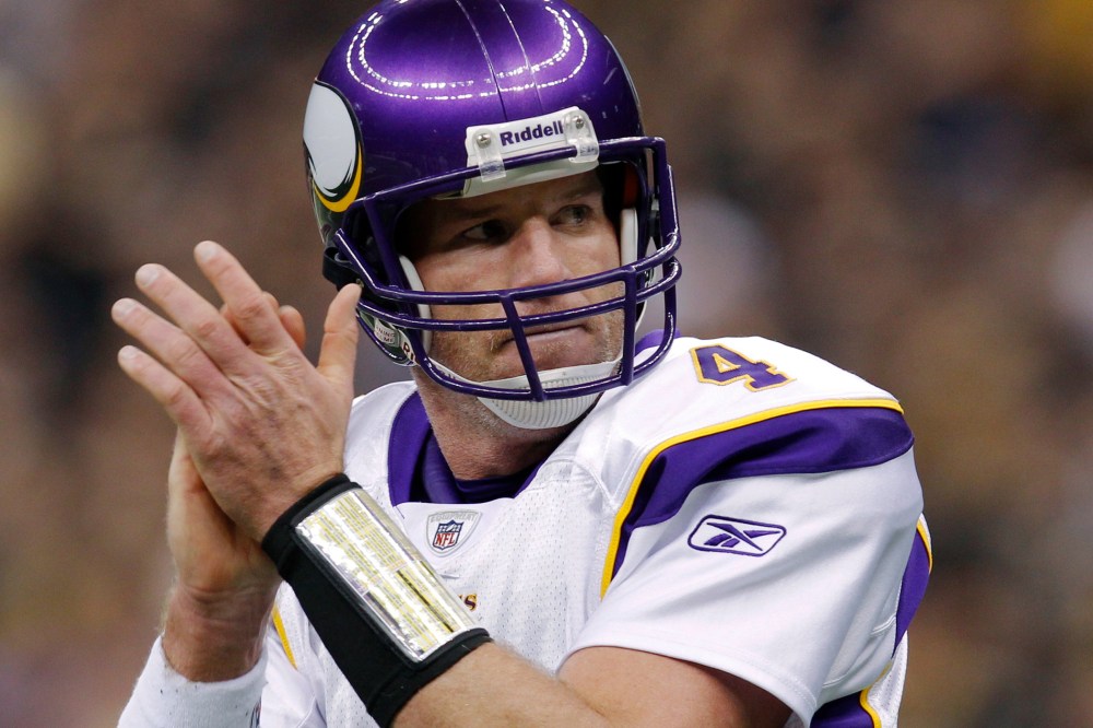 Minnesota Vikings quarterback Brett Favre celebrates his touchdown against the New Orleans Saints during the first quarter of the NFL's NFC Championship football game in New Orleans, Louisiana, Ja. 24, 2010.