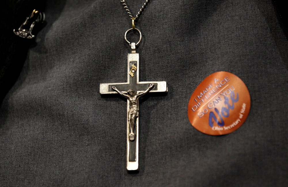 A nun wears an "I Made A Difference So Can You" voting sticker at a rally for Rick Santorum after the Ohio Republican Primary in Steubenville, Ohio, March 6, 2012.