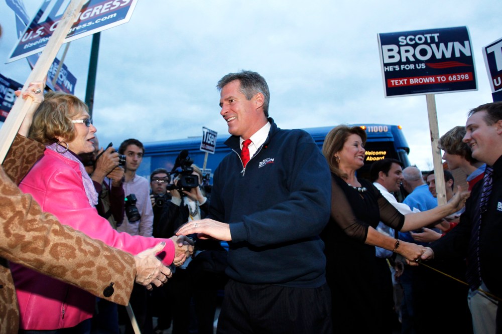 Senator Scott Brown shakes hands with supporters in Wakefield, Massachusetts Nov. 1, 2012.