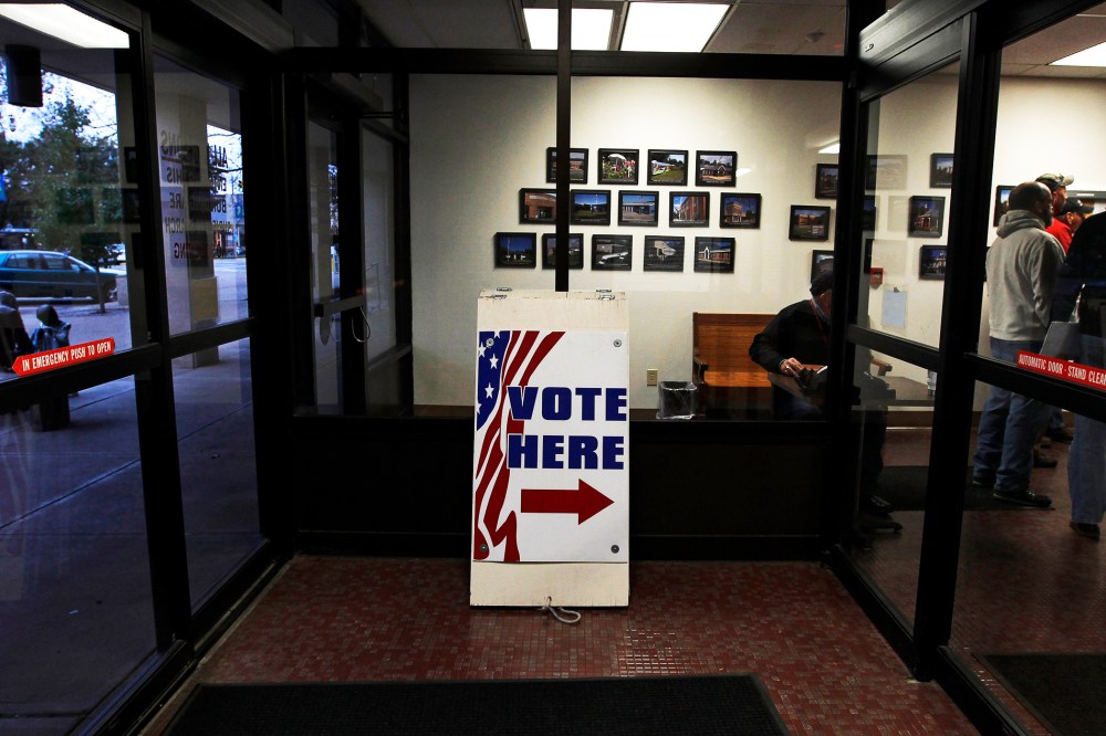 Signs direct voters to the Licking County Board of Elections to open in Newark, Ohio, Nov. 3, 2012.