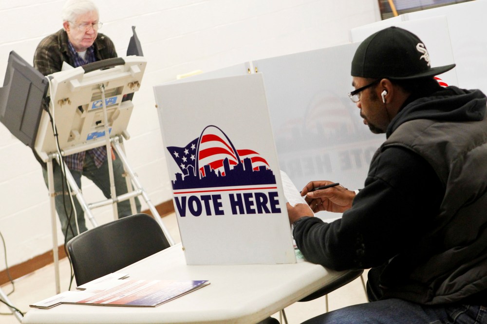 People vote at Missouri School for the Blind during the U.S. Presidential Election in St. Louis, Missouri, November 6, 2012.