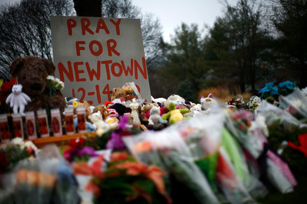 Flowers, candles and stuffed animals are seen at a makeshift memorial in Newtown, Connecticut on Dec. 17, 2012.