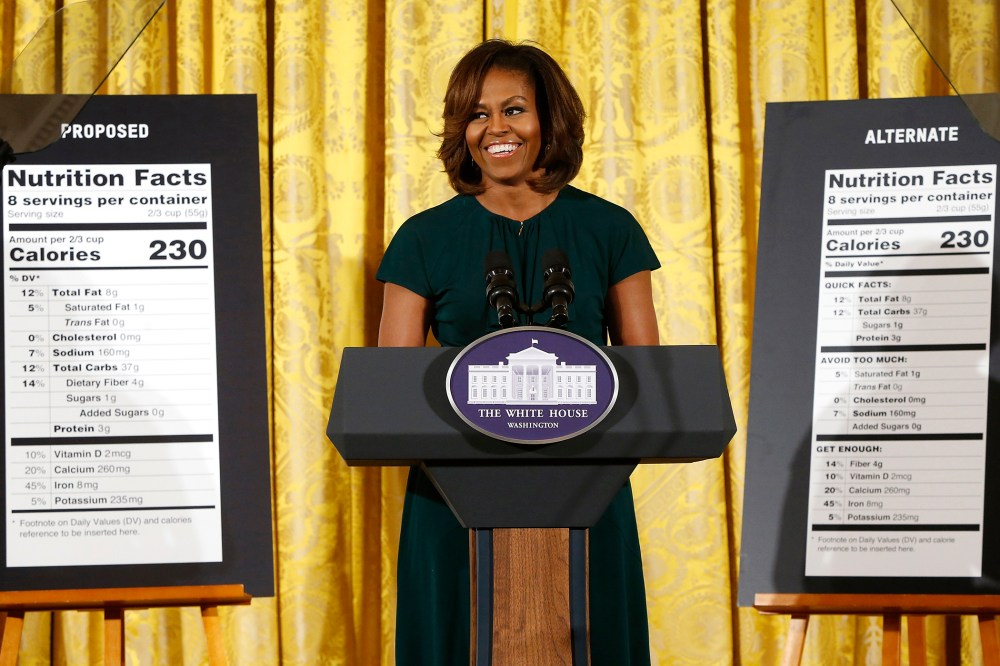 U.S. first lady Michelle Obama smiles as she unveils proposed updates to nutrition facts labels, Feb. 27, 2014.