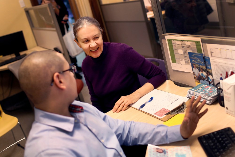 Natalia Pollack, uninsured since 1999, is assisted to sign up for health insurance through the Affordable Care Act, by Carlos Tapia, a certified application councilor in New York City, March 31, 2014.