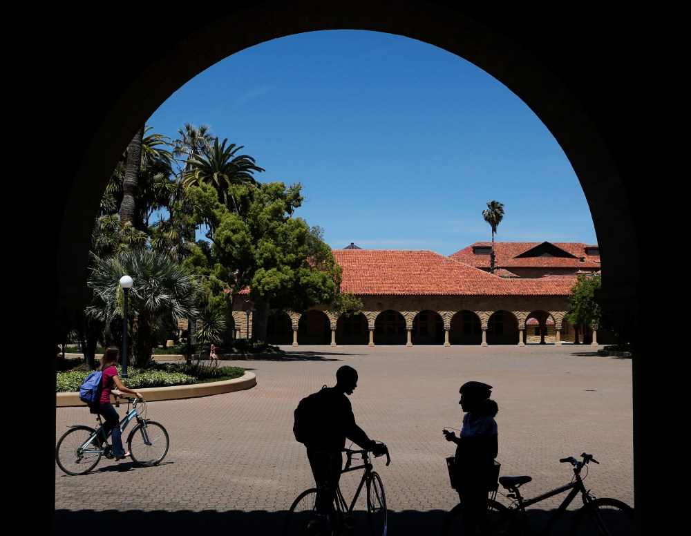 Students retrieve their bicycles after leaving a class, at the Main Quad at Stanford University in Stanford, Calif., May 9, 2014. (Photo by Beck Diefenbach/Reuters)