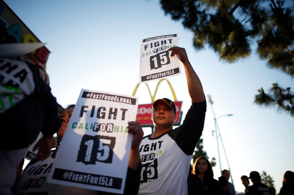 Demonstrators take part in a protest to demand higher wages for fast-food workers outside McDonald's in Los Angeles, Calif., on May 15, 2014. (Photo by Lucy Nicholson/Reuters)