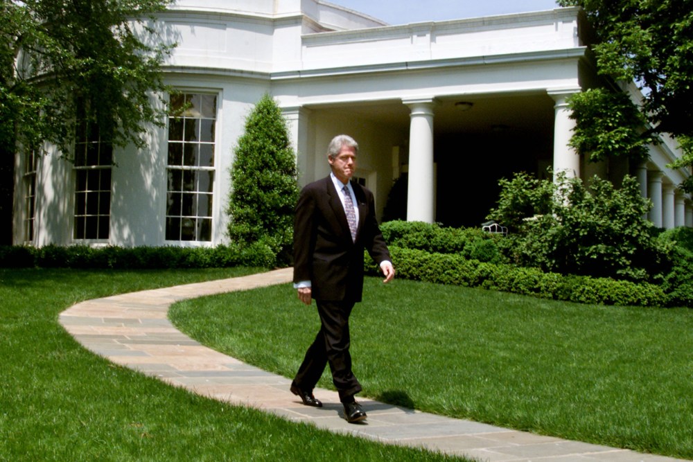 U.S. President Bill Clinton walks out of the Oval Office at the White House on his way to make a statement about the economy, May 5, 2000.