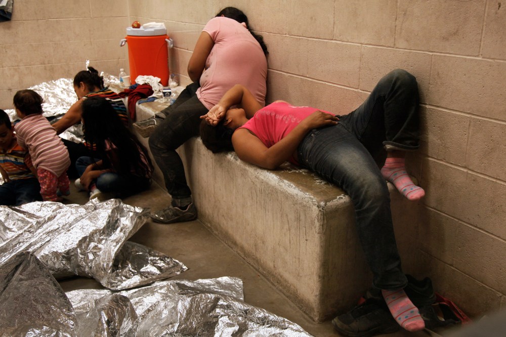 Immigrants who have been caught crossing the border illegally are housed inside the McAllen Border Patrol Station in McAllen, Texas on July 15, 2014, where they are processed. (Rick Loomis/Pool/Reuters)