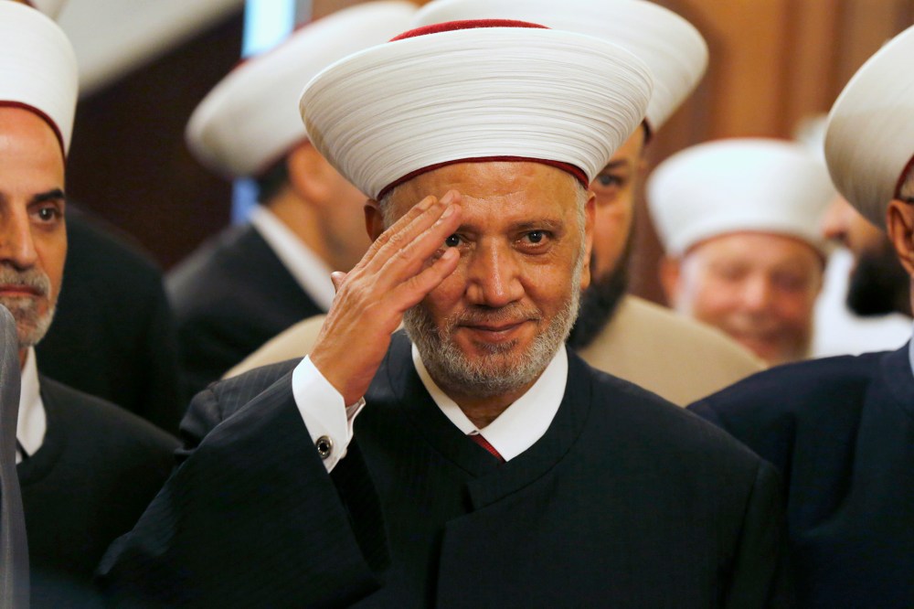 Newly appointed grand mufti Sheikh Abed el-Lateef Daryan gestures during a ceremony for his appointment in Beirut