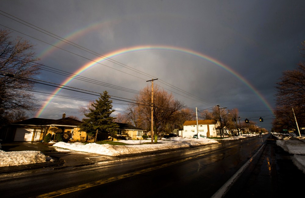 A rainbow forms over a neighbourhood following a massive snow storm in West Seneca