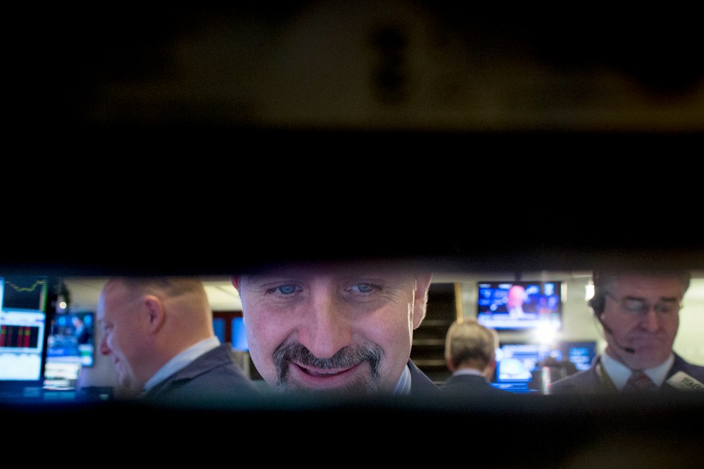 Traders work on floor of New York Stock Exchange