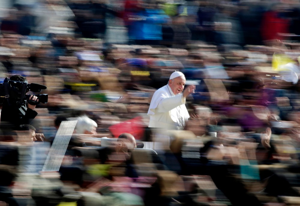 Pope Francis waves as he arrives during the general audience in St. Peter's Square at the Vatican March 4, 2015. (Photo by Max Rossi/Reuters)