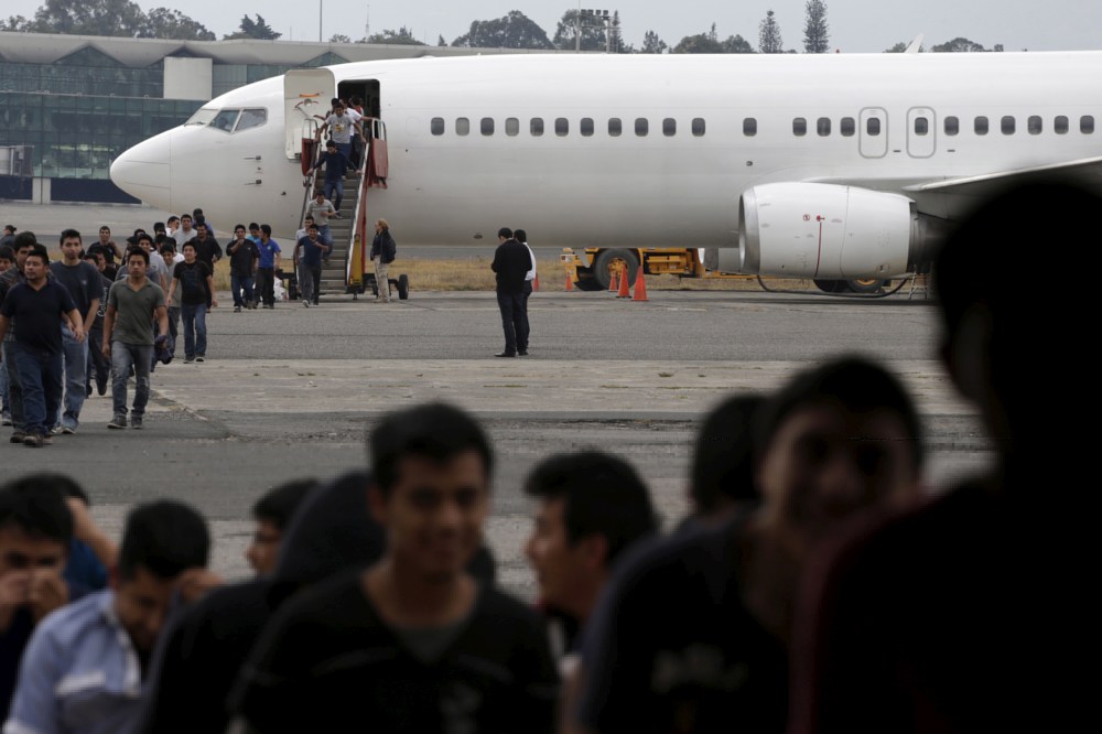 Illegal migrants from Guatemala, deported from the U.S., arrive at an air force base in Guatemala City, March 19, 2015. (Photo by Jorge Dan Lopez/Reuters)