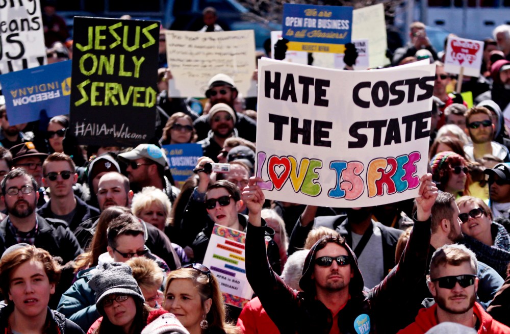 Demonstrators gather at Monument Circle to protest a controversial religious freedom bill recently signed by Governor Mike Pence, during a rally in Indianapolis March 28, 2015. (Photo by Nate Chute/Reuters)