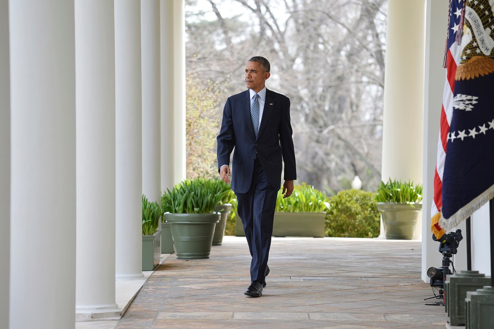 U.S. President Barack Obama walks out of the Oval Office and down the White House colonnade to make a statement in the Rose Garden in Washington, D.C., April 2, 2015. (Photo by Mike Theiler/Reuters)