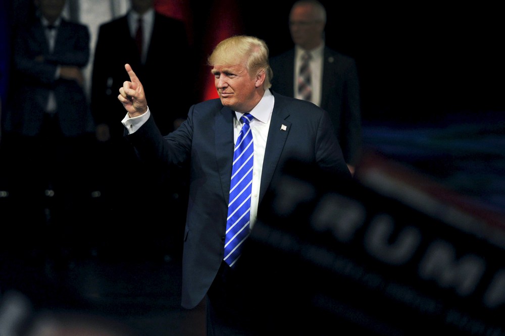 U.S. Republican Presidential candidate Donald Trump gestures as he greets the audience after speaking at a rally in Las Vegas, Nev., Oct. 8, 2015. (Photo by David Becker/Reuters)