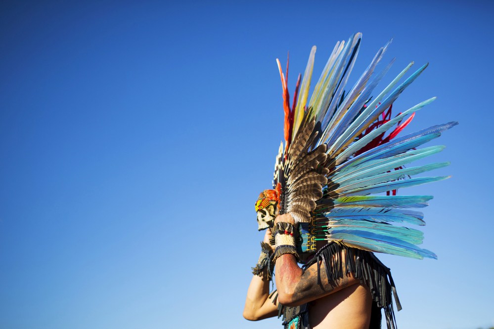 A reveler gets ready to dance during a "pow-wow" celebrating the Indigenous Peoples' Day Festival in Randalls Island, New York, Oct. 11, 2015. (Photo by Eduardo Munoz/Reuters)