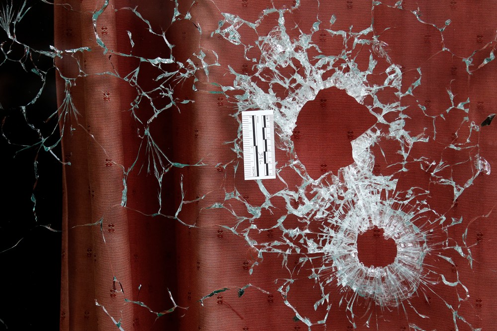 Bullet impacts are seen in the window of the Le Carillon restaurant the morning after a series of deadly attacks in Paris, Nov. 14, 2015. (Photo by Christian Hartmann/Reuters)