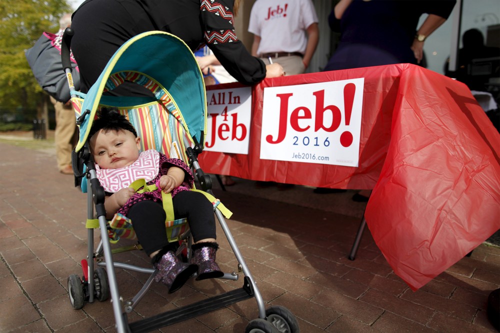 Eight-month-old Mary Elizabeth Parsons is wheeled into a campaign "meet and greet" for U.S. Republican presidential candidate Jeb Bush at Wholly Smokin BBQ, Florence, S.C., Nov. 17, 2015. (Photo by Randall Hill/Reuters)