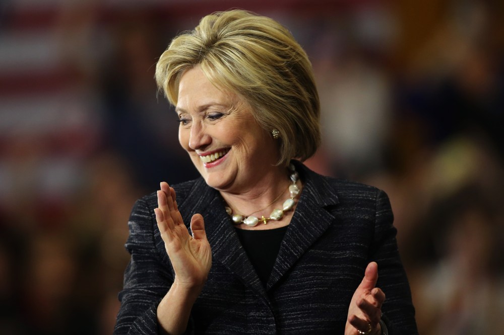 Democratic presidential candidate Hillary Clinton claps as she speaks to supporters about primary voting results in Michigan and other states, at her campaign rally in Cleveland, Ohio, March 8, 2016. (Photo by Aaron Josefczyk/Reuters)