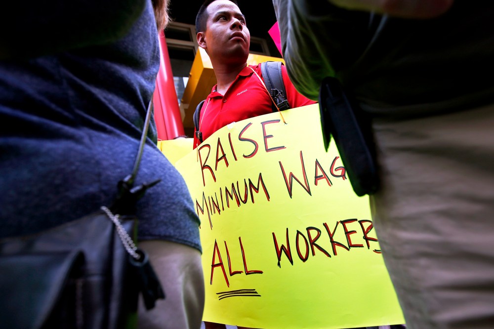 Low wage workers take part in a protest organized by the Coalition for a Real Minimum Wage in New York, May 30, 2013.
