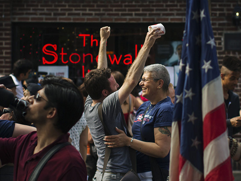 People embrace and cheer as they join a crowd celebrating the U.S. Supreme Court ruling against the Defense of Marriage Act outside the Stonewall Inn in New York June 26, 2013. The U.S. Supreme Court delivered a landmark victory for gay rights on...