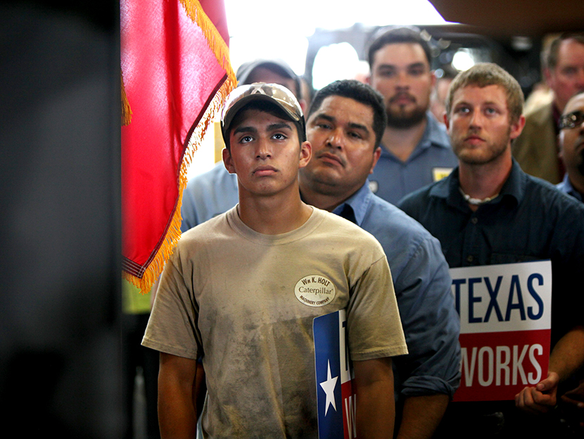 Employees of Holt Cat listen as Texas governor Rick Perry announces he is not running for re-election as governor of Texas in 2014 during a news conference in San Antonio, Texas July 8, 2013. (Photo by Erich Schlegel/Reuters)