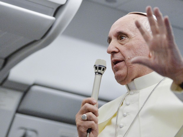 Pope Francis talks with journalists as he flies back Rome following his visit to Brazil July 29, 2013. (Photo by Luca Zennaro/Pool/Reuters)