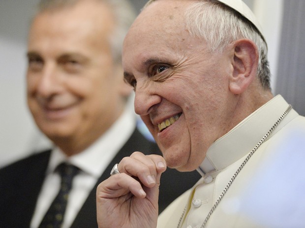 Pope Francis listens to journalists' questions as he flies back Rome following his visit to Brazil July 29, 2013.(Photo by Luca Zennaro/Reuters)