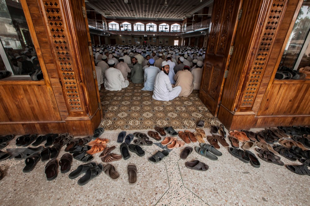 Pakistani religious students attend a lesson at Darul Uloom Haqqania, an Islamic seminary and alma mater of several Taliban leaders, in Akora Khattak, Khyber Pakhtunkhwa province Sep. 14, 2013. (Photo by Zohra Bensemra/Reuters)