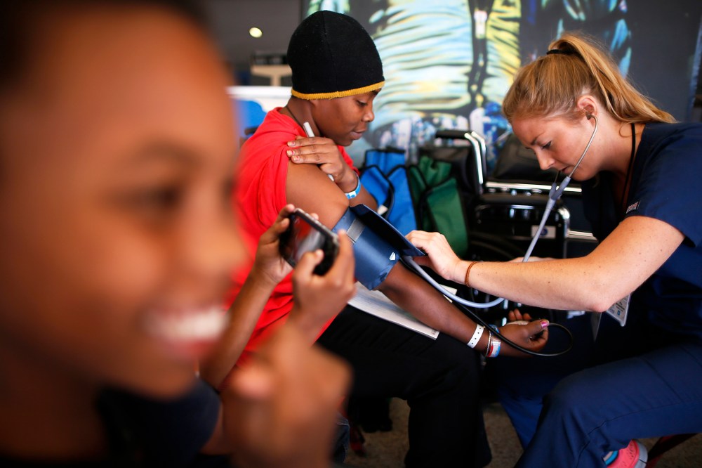 Patricia Broaster has her blood pressure measured at Care Harbor LA, a free medical clinic in Los Angeles, Oct. 31, 2013.