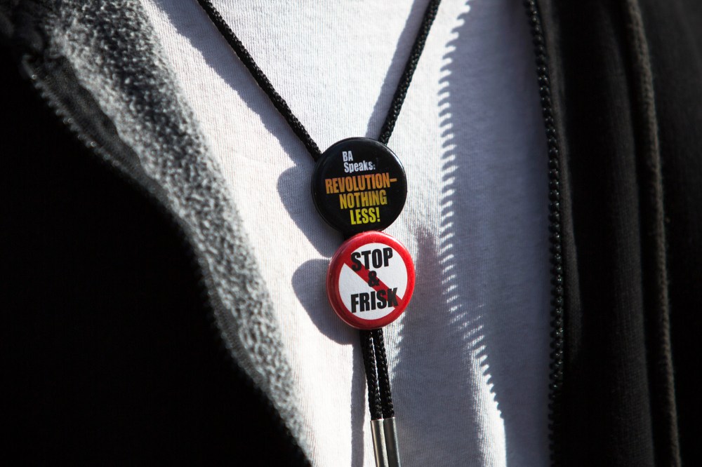 Noche Diaz wears badges at a news conference against the Stop-and-Frisk program, outside the Federal Court in New York November 1, 2013.