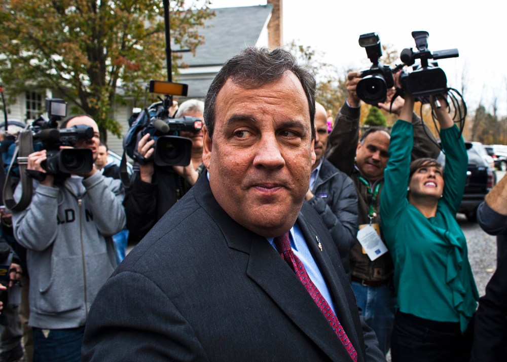 New Jersey Governor Chris Christie speaks with media after casting his vote, November 5, 2013.