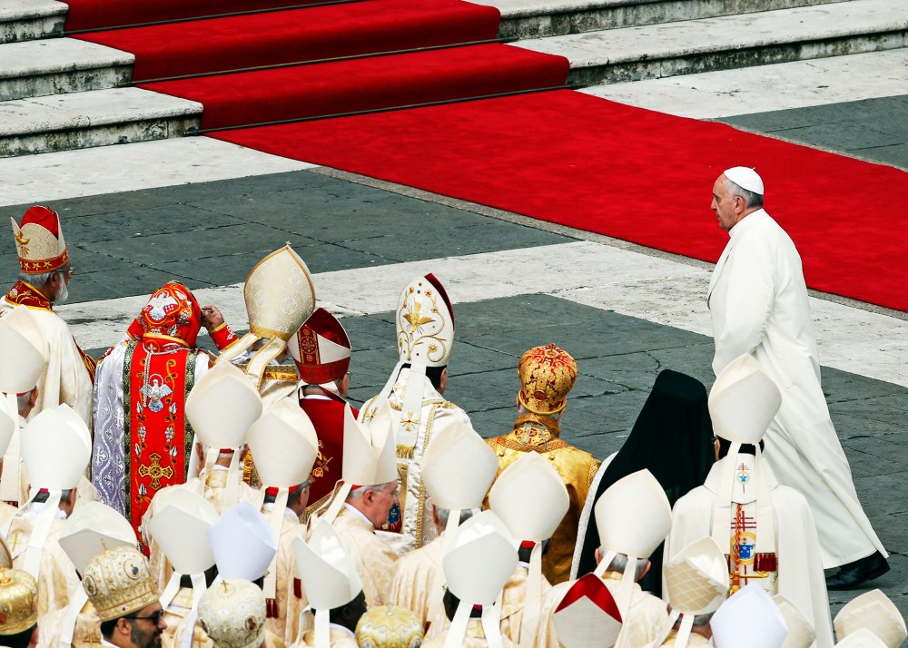 Pope Francis walks away at the end of a mass at the Vatican, Nov. 24, 2013.