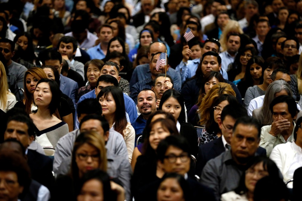 Immigrants take part in a naturalization ceremony for new U.S. citizens in Los Angeles