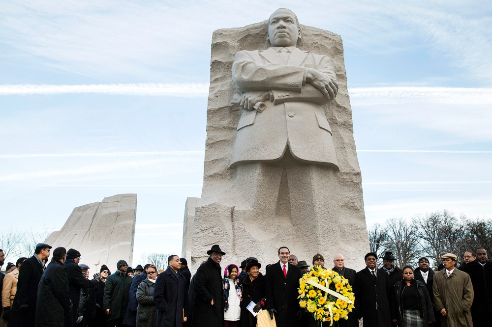 Vincent Gray, mayor of Washington, DC, takes part in a wreath laying ceremony at the Martin Luther King Memorial in Washington, Jan. 20, 2014.