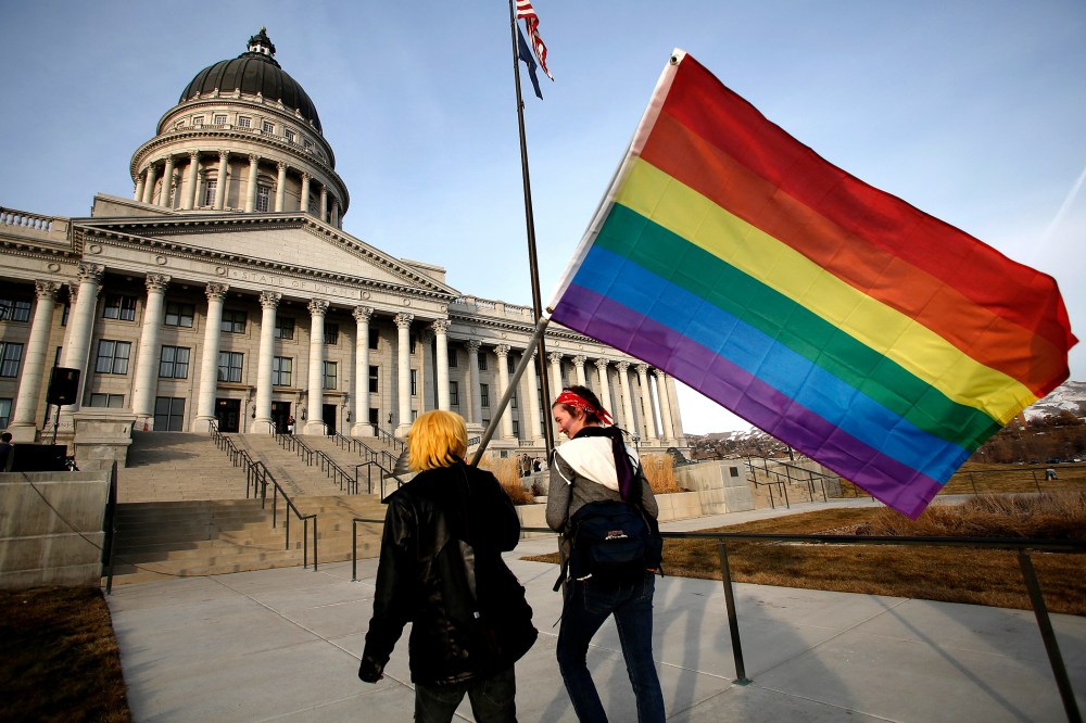 Corbin Aoyagi (L) and Jerusha Cobb walk to join supporters of same-sex marriage rally at Utah's State Capitol building in Salt Lake City, Utah on Jan. 28, 2014.