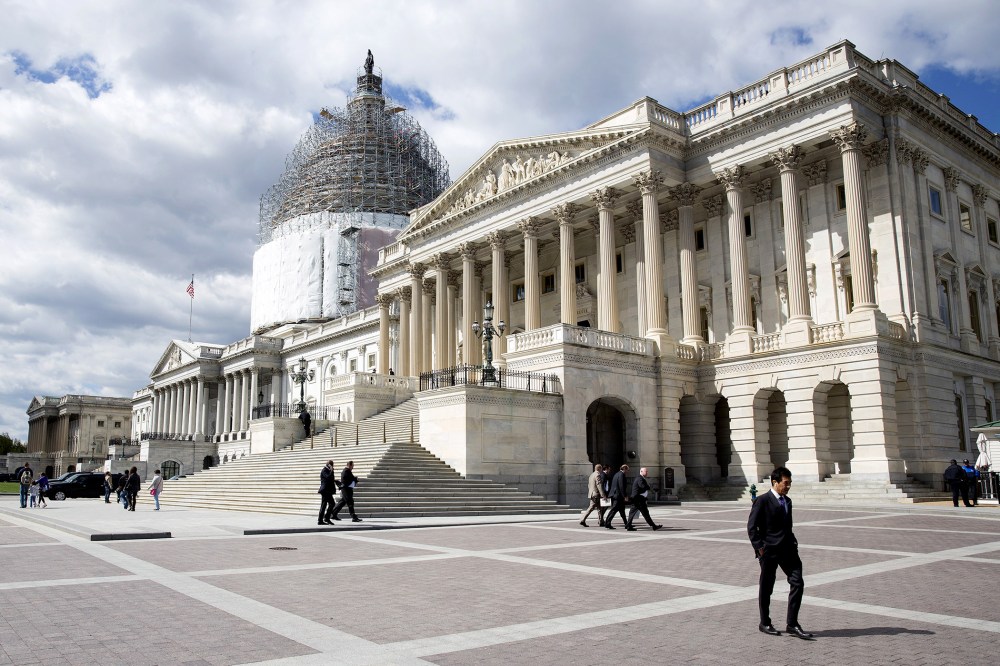 A man walks in front of the U.S. Capitol in Washington on April 23, 2015.
