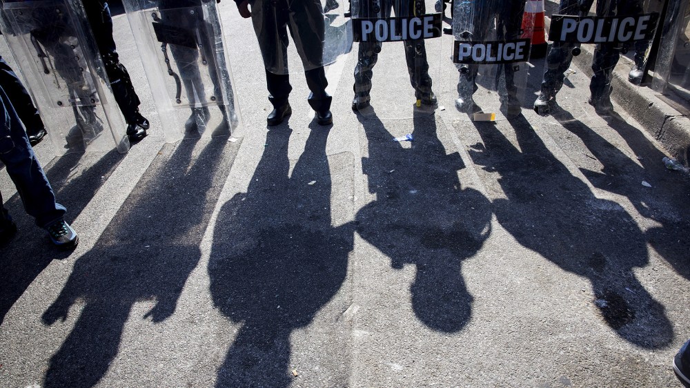 Police gather at North Ave and Pennsylvania Ave in Baltimore, Md., April 28, 2015. (Photo by Eric Thayer/Reuters)
