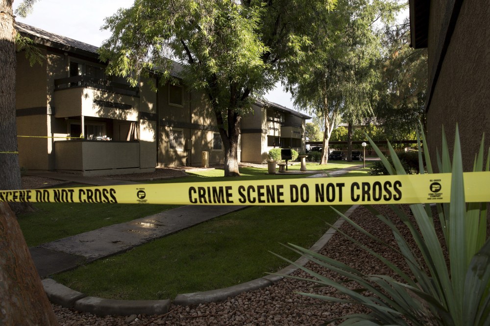Crime scene tape surrounds buildings at the Autumn Ridge apartment complex which had been searched by investigators in Phoenix, Ariz., May 4, 2015. (Photo by Nancy Wiechec/Reuters)