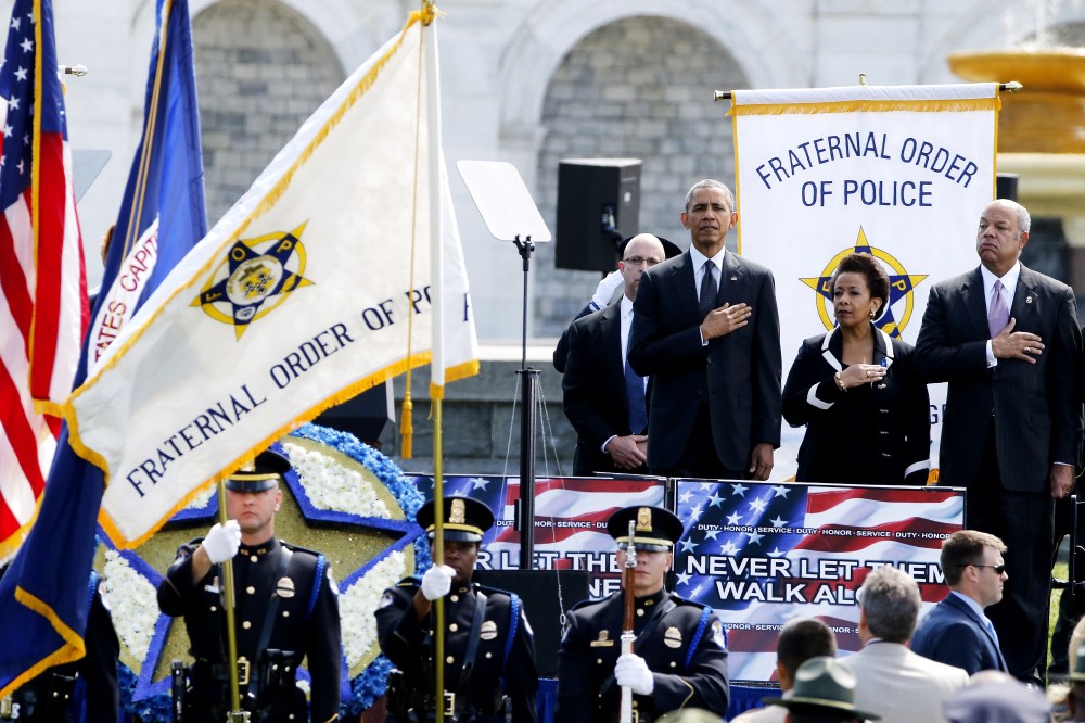 U.S. President Barack Obama, Attorney General Loretta Lynch and Homeland Security Secretary Jeh Johnson stand for the national anthem at the National Peace Officers' Memorial Service in Washington May 15, 2015. (Photo by Jonathan Ernst/Reuters)