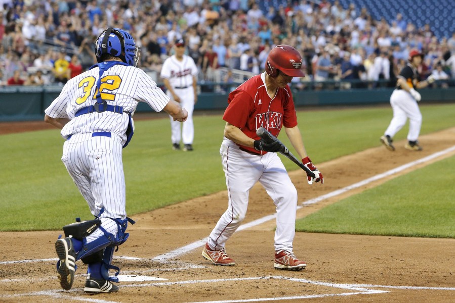U.S. Senator Rand Paul (R-KY) (C, in red) reacts to striking out during the annual Congressional Baseball Game, pitting Republicans against Democrats for charity, at Nationals Park in Washington, June 11, 2015. (Photo by Jonathan Ernst/Reuters)