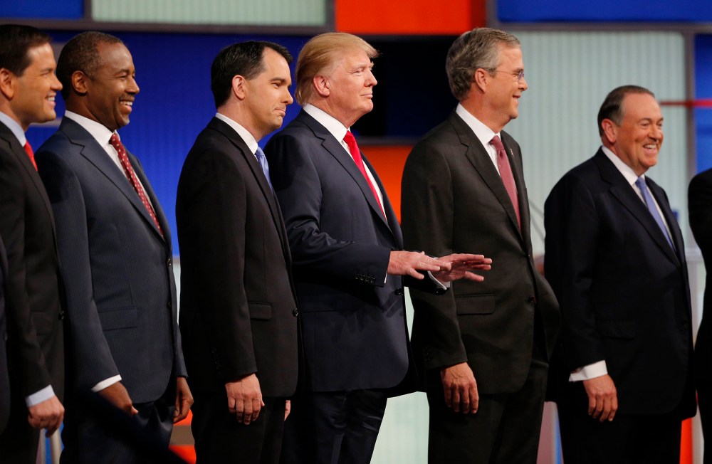 Republican 2016 presidential candidates pose at the start of the first official Republican presidential candidates debate of the 2016 U.S. presidential campaign in Cleveland