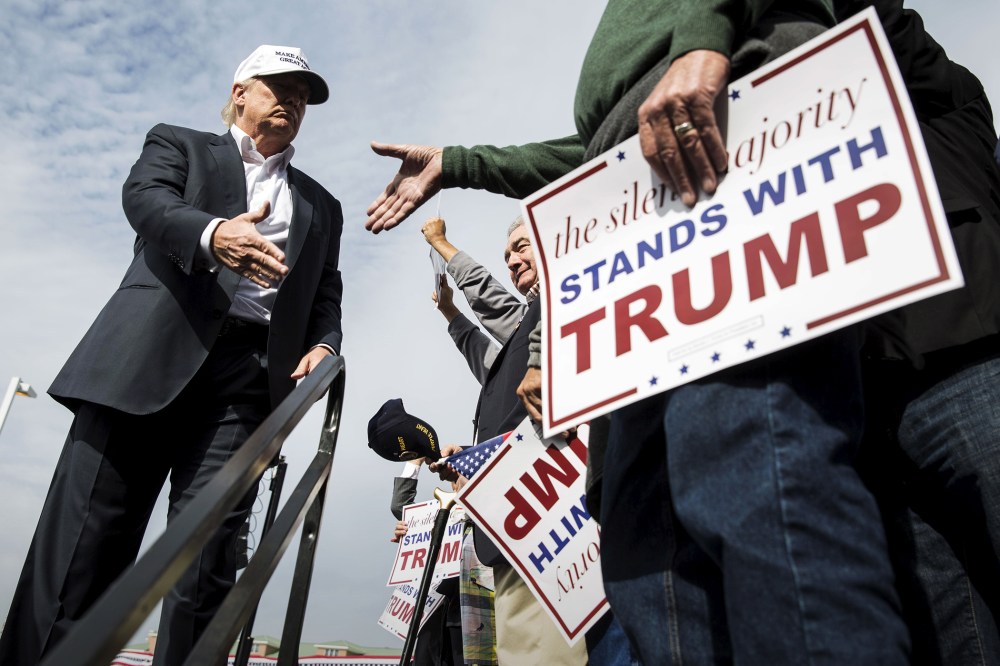 U.S. Republican presidential candidate Donald Trump shakes hands with a supporter during a campaign rally at the USS Wisconsin battleship in Norfolk, Va., Oct. 31, 2015. (Photo by Joshua Roberts/Reuters)