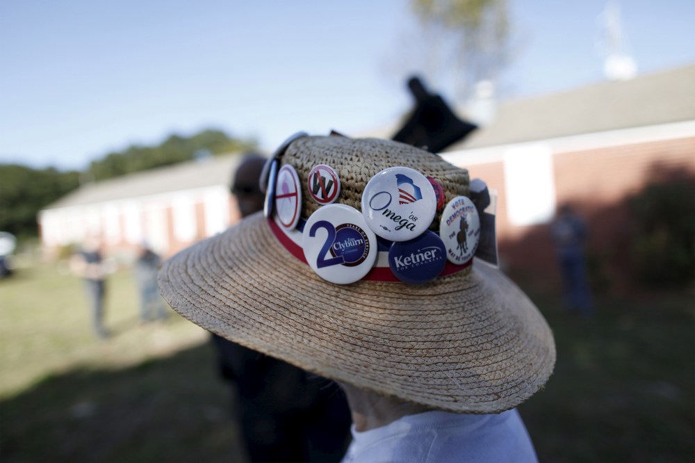 Undecided voter Mimi Dias of Charleston wears her Democratic hat before the start of a speech by U.S. Democratic presidential candidate Bernie Sanders at the annual Blue Jamboree in North Charleston, S.C., Nov. 21, 2015. (Photo by Randall Hill/Reuters)