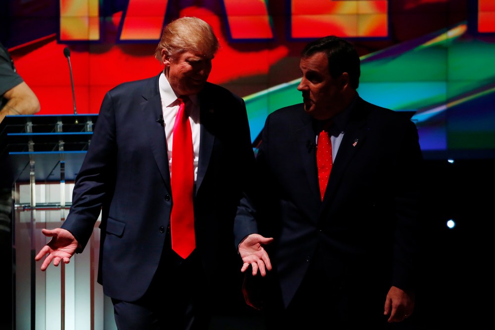 Republican U.S. presidential candidates Donald Trump and Chris Christie talk during a commercial break of the Republican presidential debate in Las Vegas, Nev., Dec. 15, 2015. (Photo by Mike Blake/Reuters)