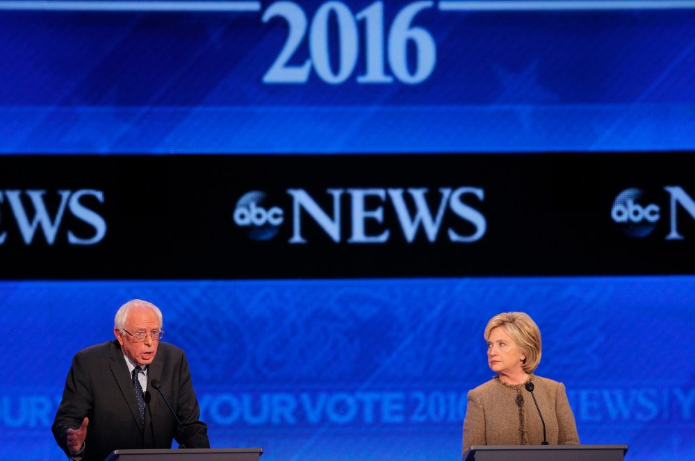 Democratic presidential candidate Hillary Clinton listens as Senator Bernie Sanders defends his positions and votes on gun control at the presidential debate at St. Anselm College in Manchester, N.H. Dec. 19, 2015. (Photo by Brian Snyder/Reuters)